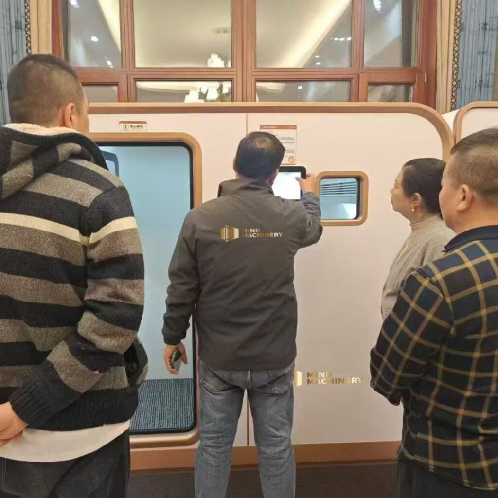 Mind staff demonstrating hyperbaric chamber operation to client